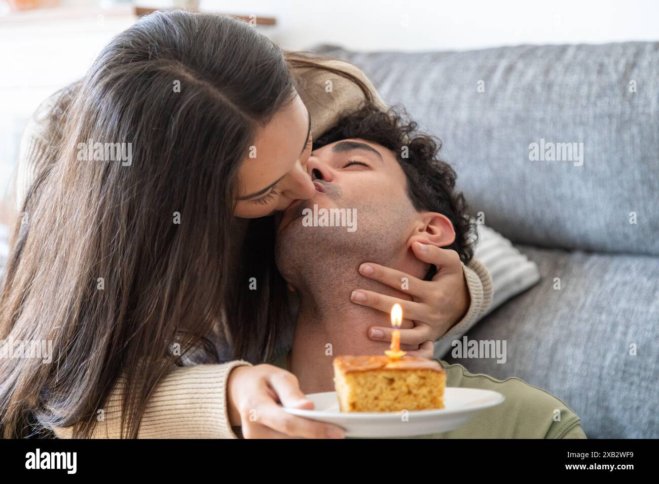 Woman kisses man cheek hi-res stock photography and images - Alamy