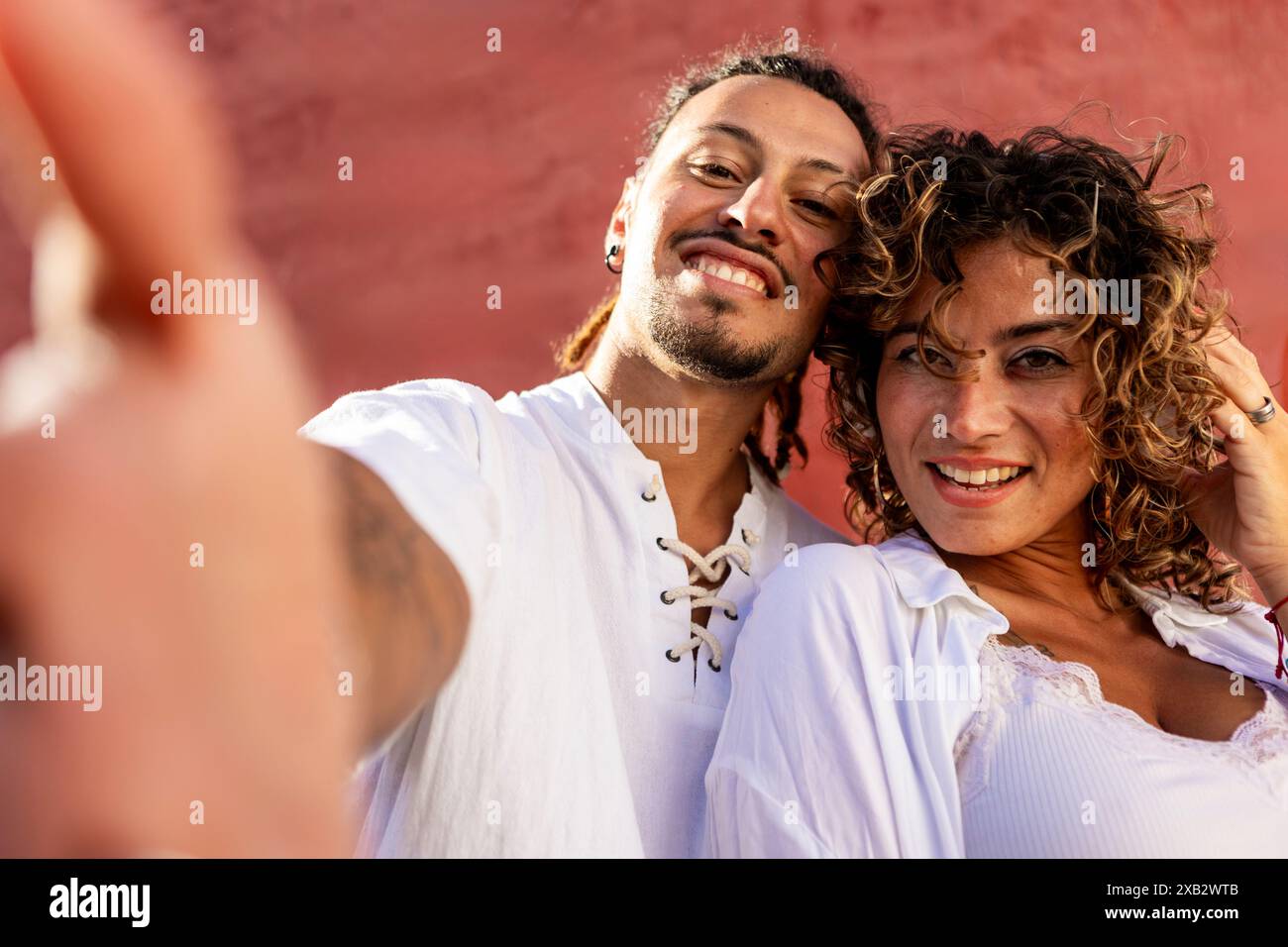 Young couple in white shirts hi-res stock photography and images - Alamy