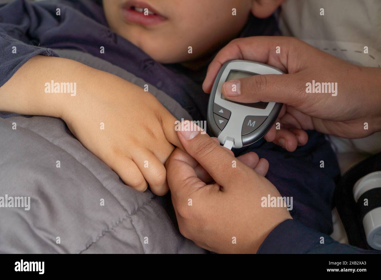 Blood sugar test child hi-res stock photography and images - Alamy