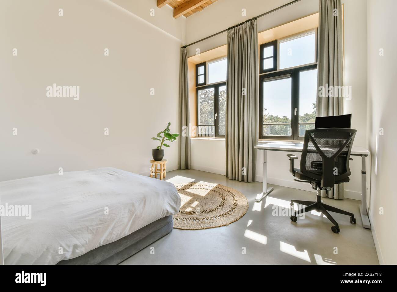 A cozy and minimalistic bedroom featuring a comfortable bed, modern ...