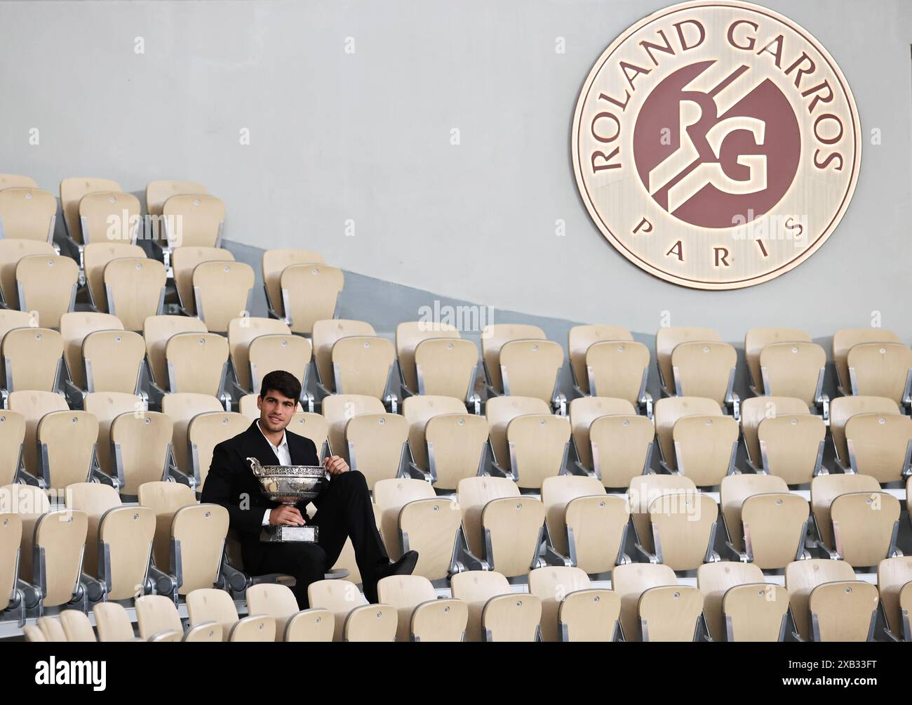 Paris, France. 10th June, 2024. Spain's Carlos Alcaraz poses with the trophy one day after winning the men's singles final of the French Open tennis tournament in Paris, France, June 10, 2024. Credit: Gao Jing/Xinhua/Alamy Live News Stock Photo