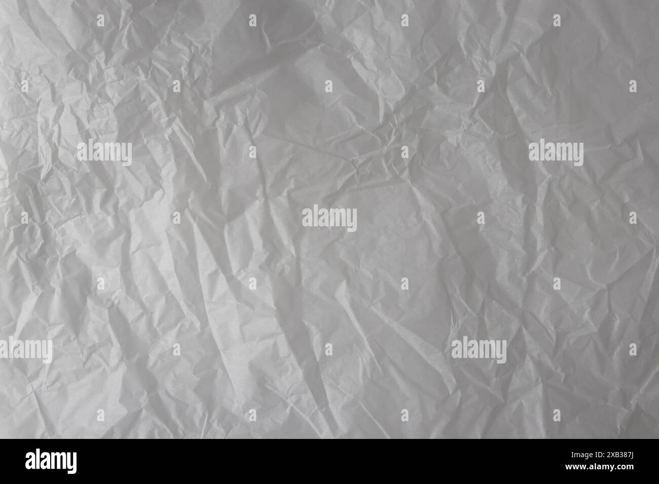 White wrinkled wrapping paper background. Thin subtle paper texture ...