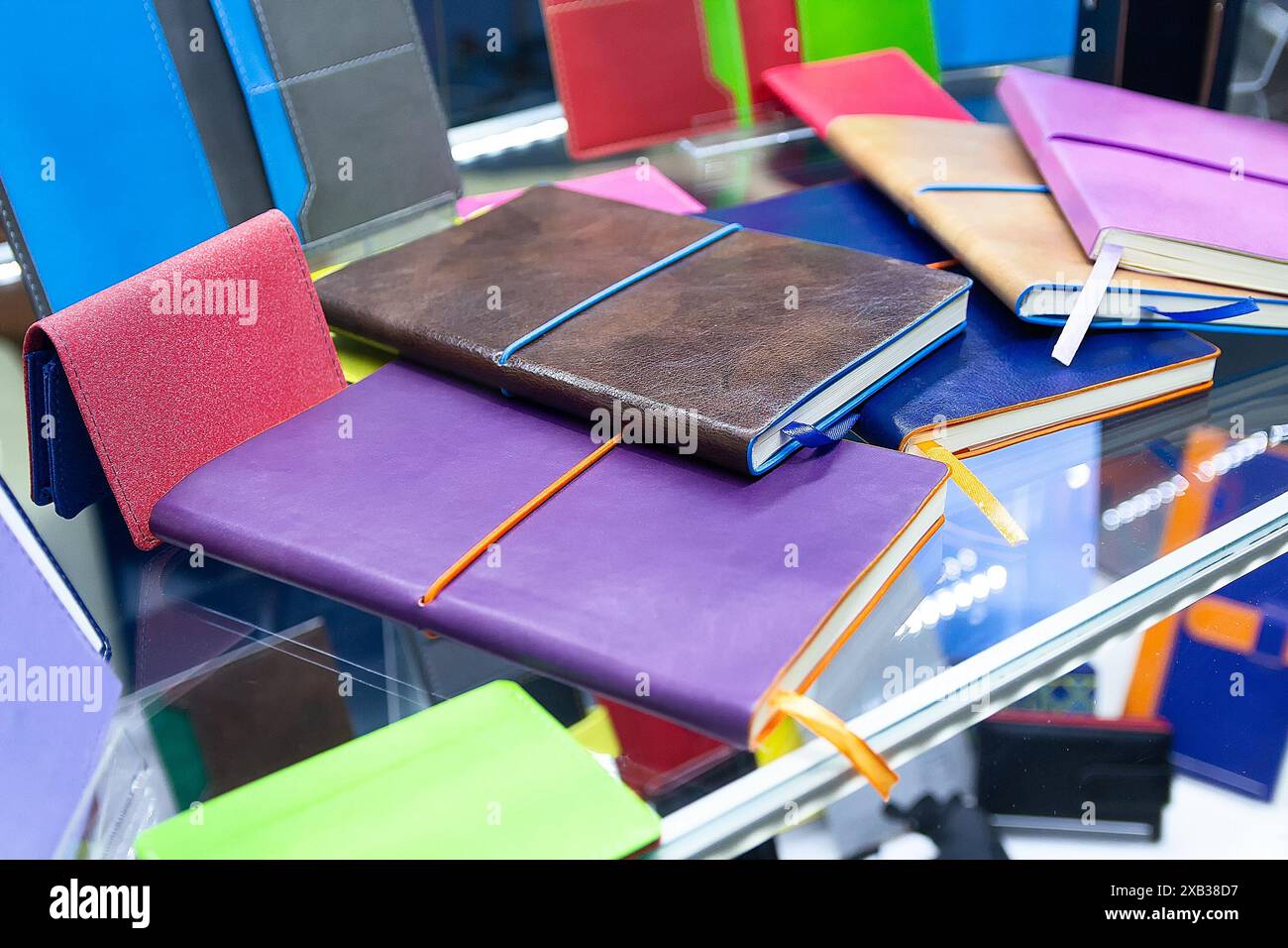 Multicolored notepads on a counter in a supermarket. Office Stock
