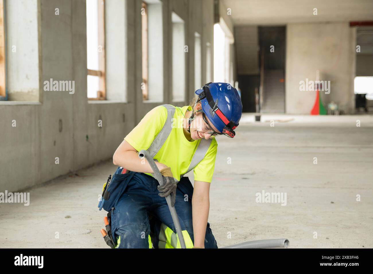 Female engineer with equipment working at construction site Stock Photo