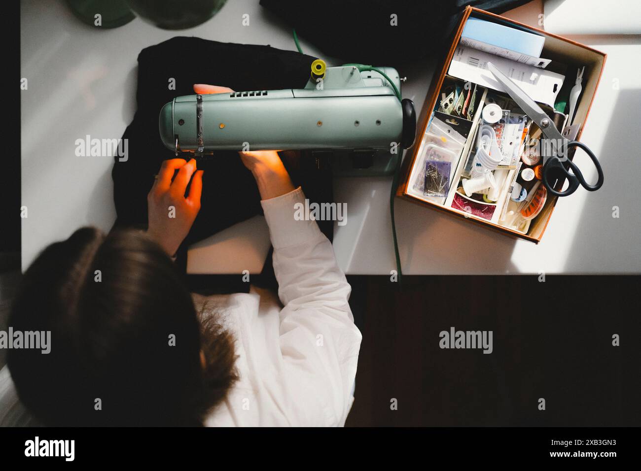 Person using white sewing machine hi-res stock photography and images ...