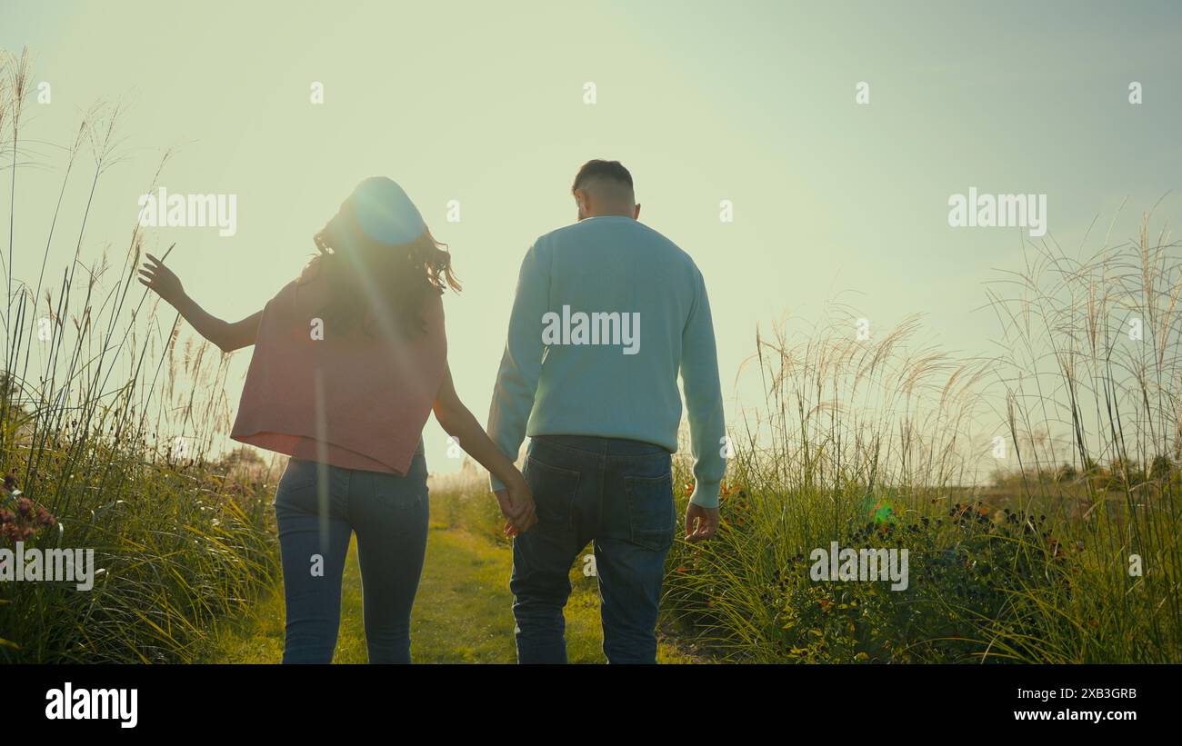 Girl and guy holding hands hi-res stock photography and images - Alamy