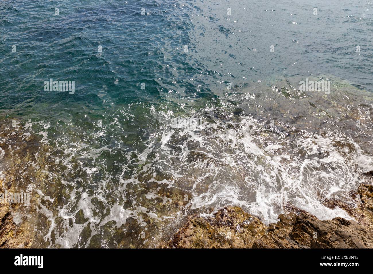 Crystal clear ocean waves rocky hi-res stock photography and images - Alamy