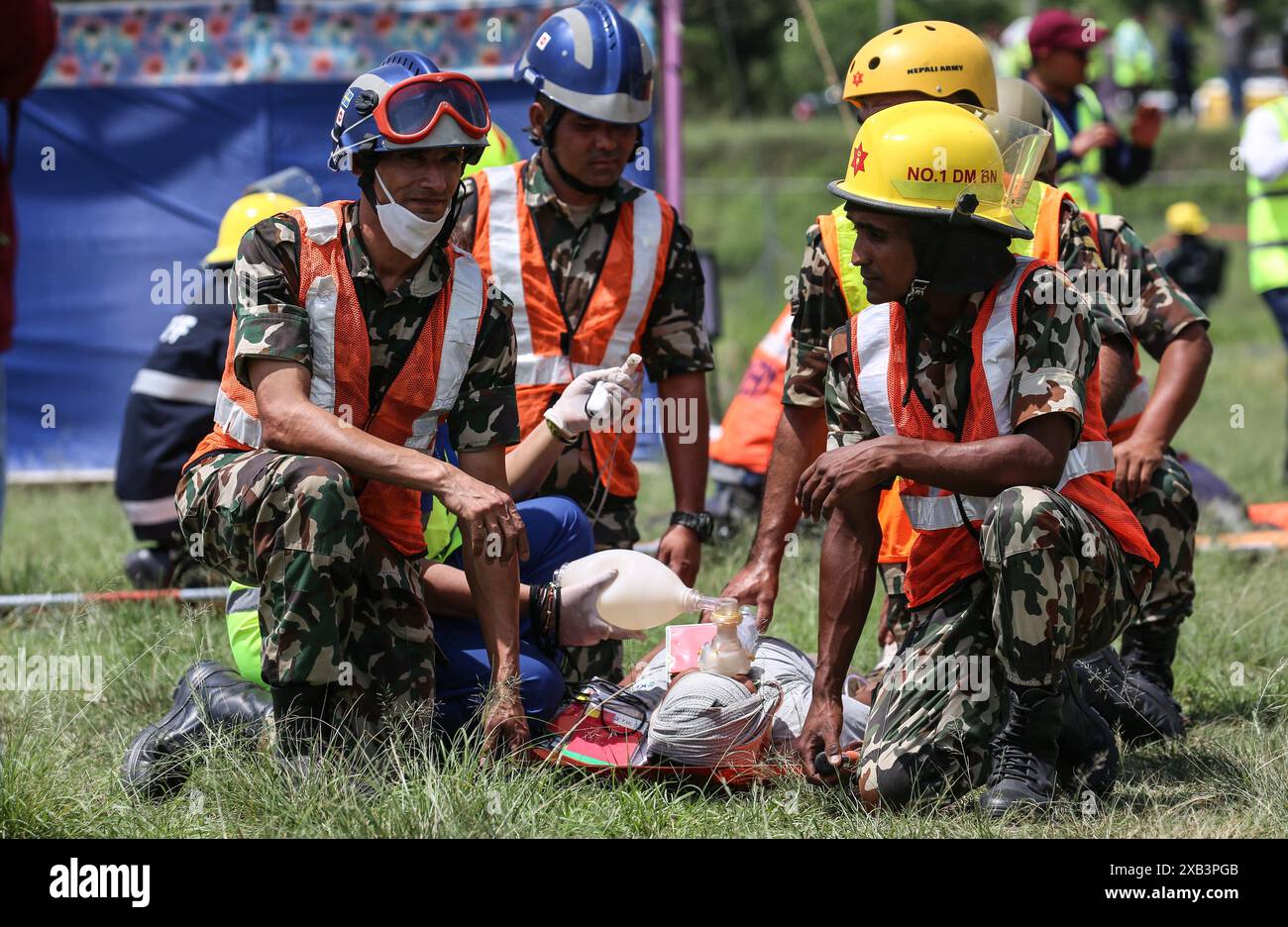 June 10, 2024: Nepal Army personnel take care of an injured man after a dummy aircraft got fire during a full scale emergency exercise drill at Tribhuwan International Airport in Kathmandu, Nepal on June 10, 2024. (Credit Image: © Sunil Sharma/ZUMA Press Wire) EDITORIAL USAGE ONLY! Not for Commercial USAGE! Stock Photo