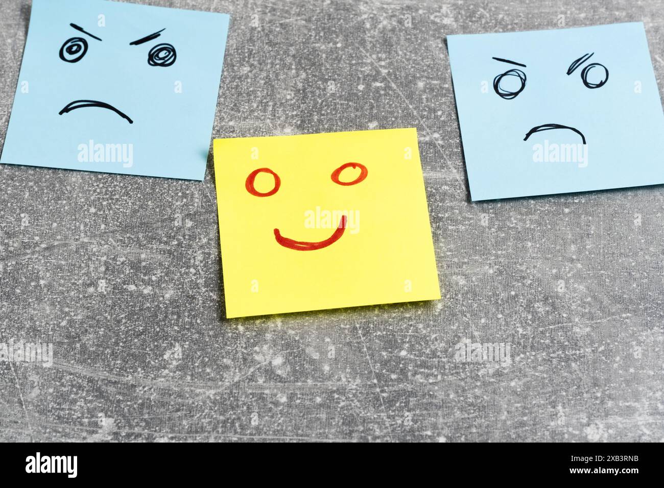Emotional smiley faces on sticky notes on grey background, closeup Stock Photo