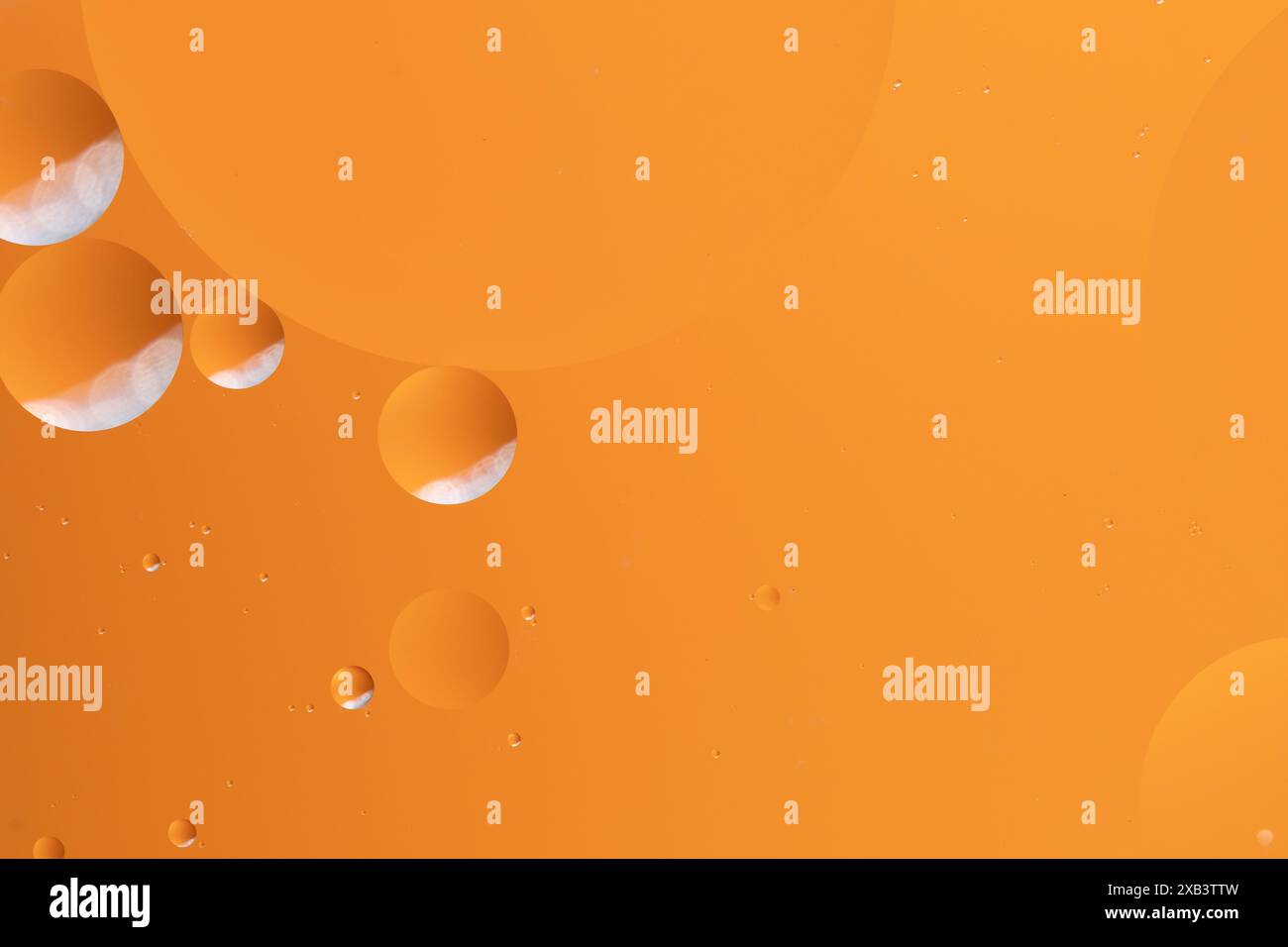 Abstract art featuring vibrant orange hues with bubble like forms Stock Photo