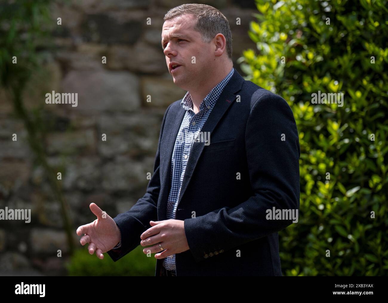 Scottish Conservatives Roles Scottish Conservative leader Douglas Ross speaks to the media in ...