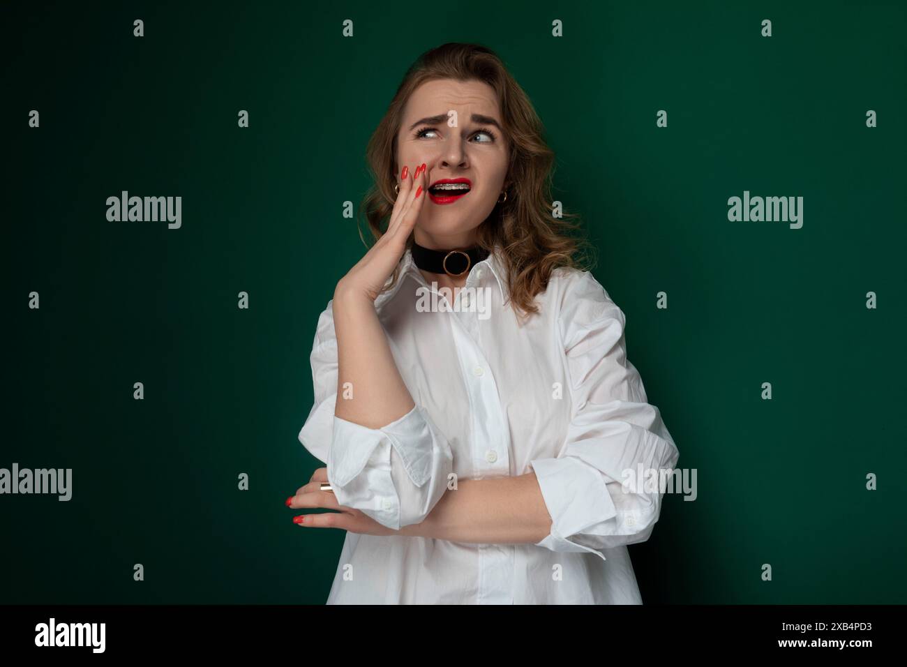 Woman in White Shirt Poses for Picture Stock Photo - Alamy