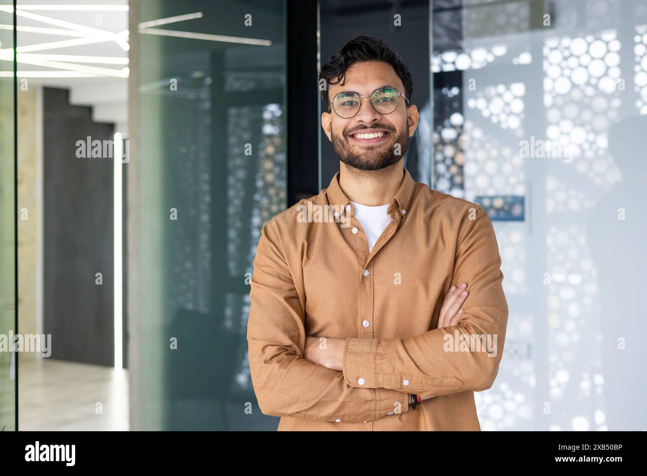 Indian man standing confidently hi-res stock photography and images - Alamy