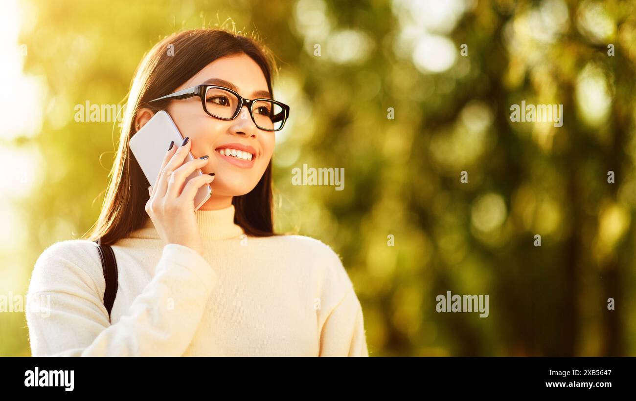 Focused asian woman wearing hi-res stock photography and images - Alamy
