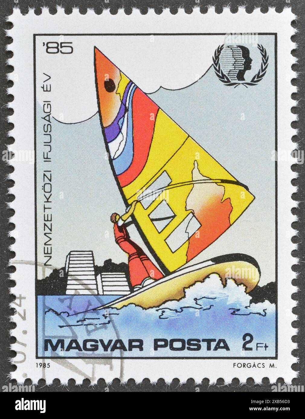 Cancelled postage stamp printed by Hungary, that shows Windsurfing, International Youth Year, circa 1985. Stock Photo