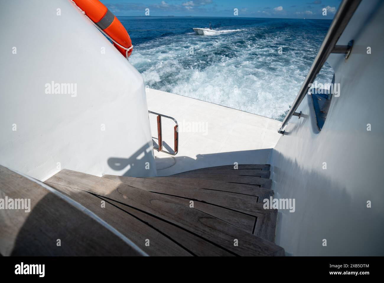 View from the main boat on a Maldives diving safari, showing a smaller ...