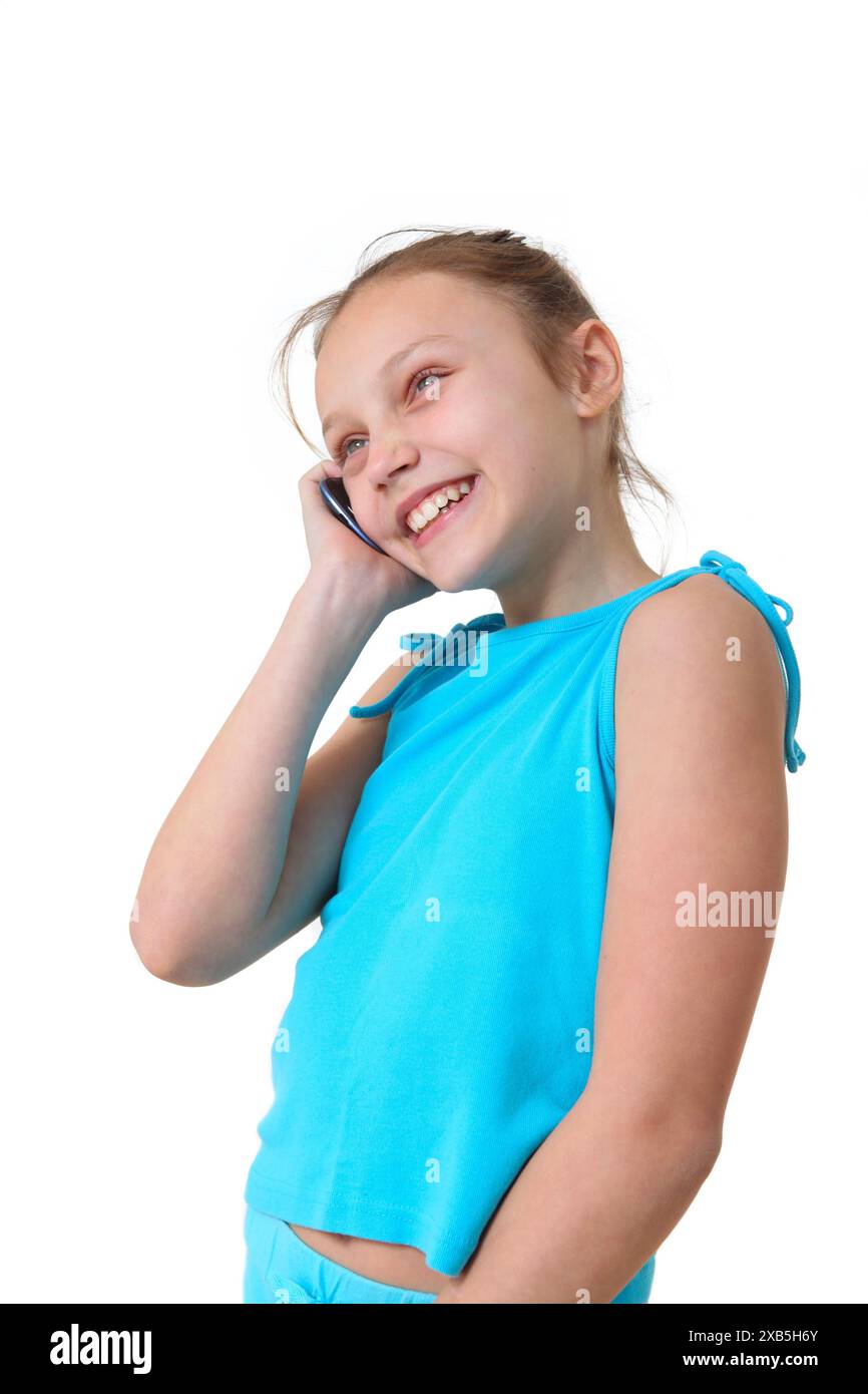 cheerful preteen girl talking on cellphone Stock Photo - Alamy