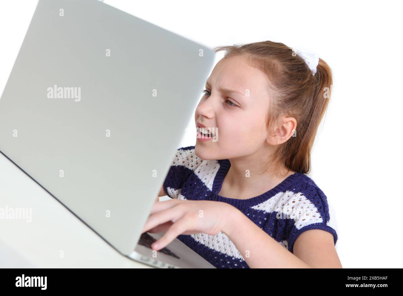 preteen girl using laptop on white background Stock Photo - Alamy
