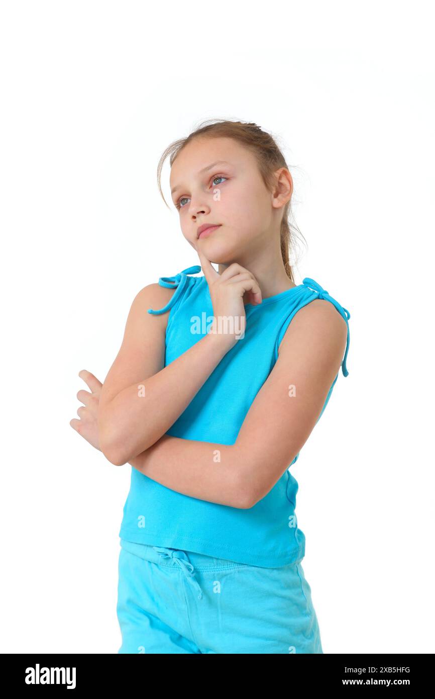 preteen girl deep in thoughts on white background Stock Photo