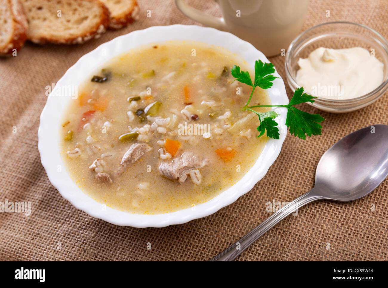 Traditional Russian soup rassolnik made from pickled cucumbers, pearl
