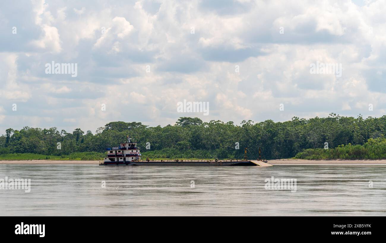 Vehicle transport boat on Napo River, Yasuni National Park, Amazon rainforest, Ecuador. Stock Photo