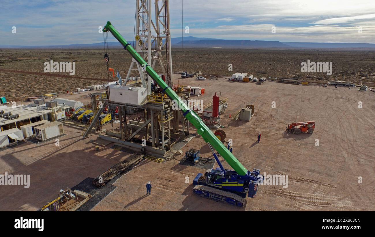 Vaca Muerta, Argentina, December 25, 2015: Extraction of unconventional oil. Battery of pumping trucks for hydraulic fracturing (Fracking). Stock Photo