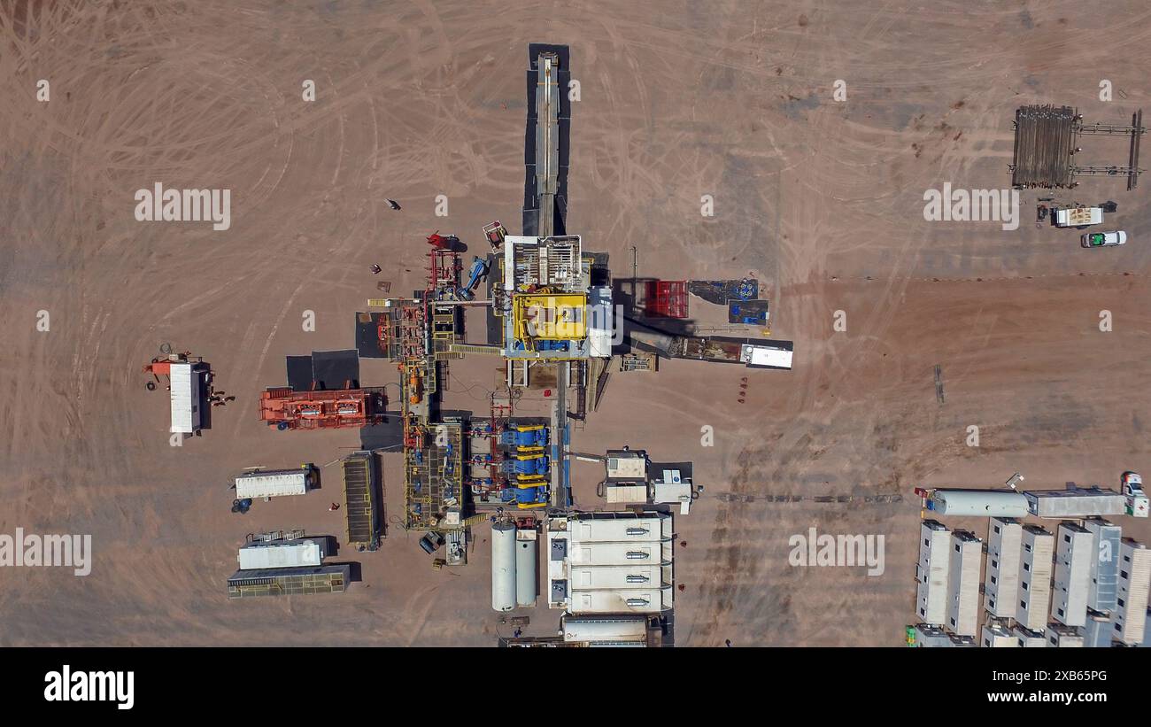 Vaca Muerta, Argentina, December 25, 2016: Extraction of unconventional oil. Battery of pumping trucks for hydraulic fracturing (Fracking). Stock Photo