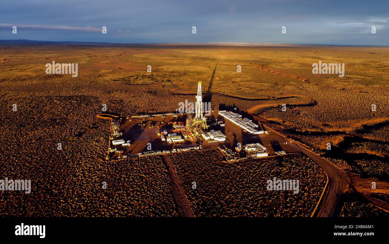 Aerial photo of hydraulic fracturing equipment at sunset. (FRACKING) Stock Photo