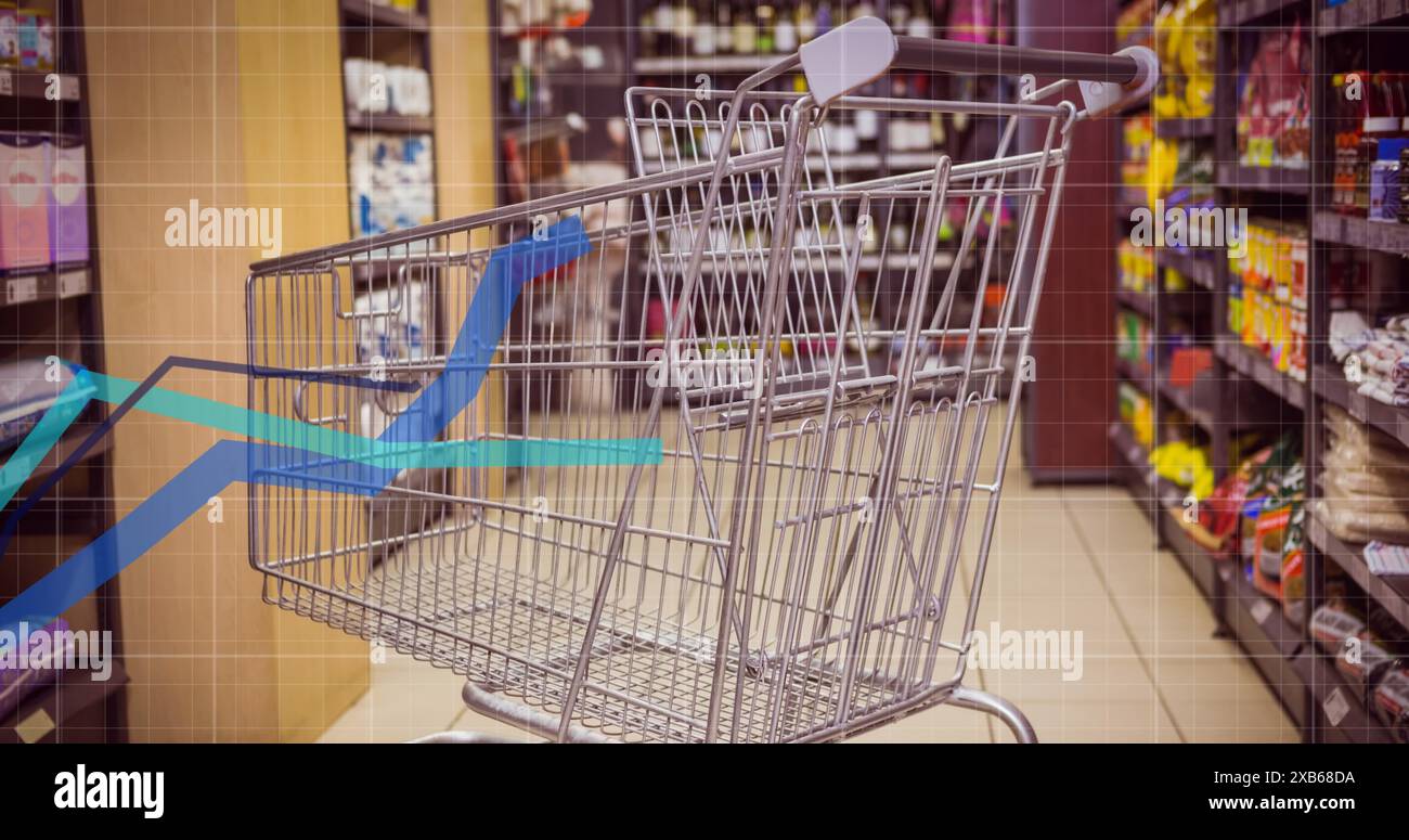 Empty shopping cart in grocery store aisle Stock Photo