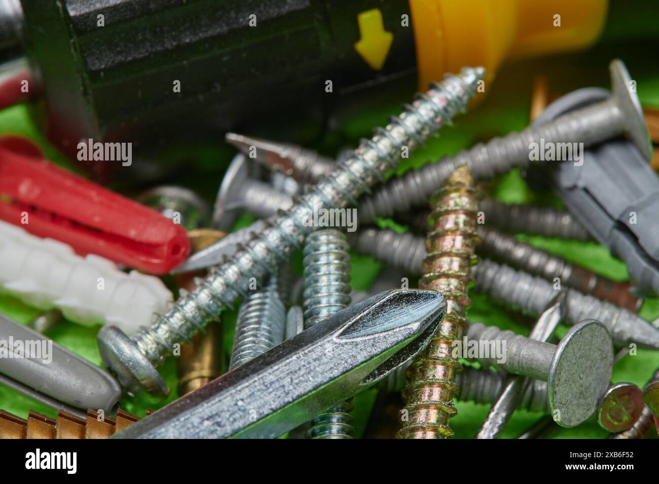 Household fasteners and hand tools, ratchet screw driver, screwdriver, nails, Wall plugs, screws, Household fasteners for the DIY handyman/woman!!! Stock Photo