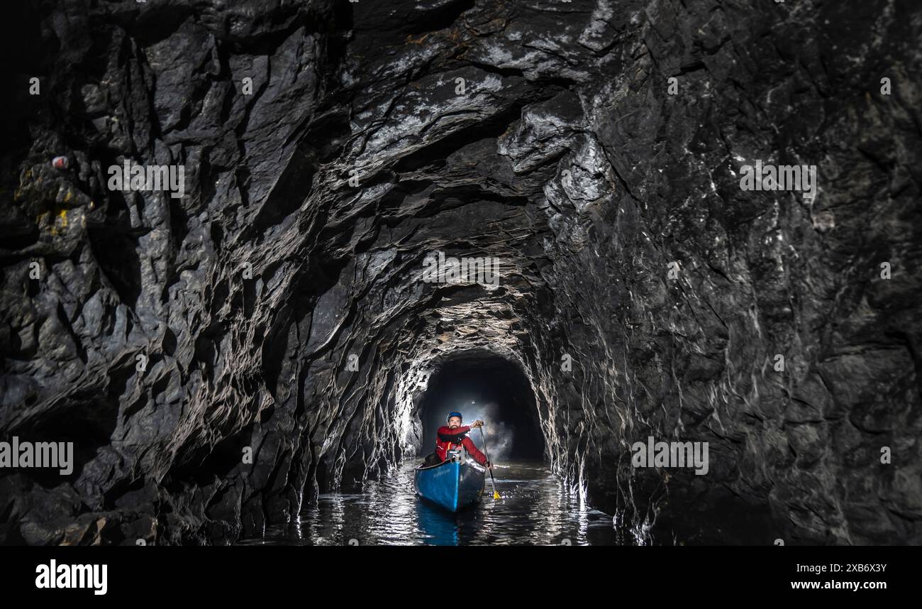Canal & River Trust team leader Gordon McMinn, canoes through Standedge