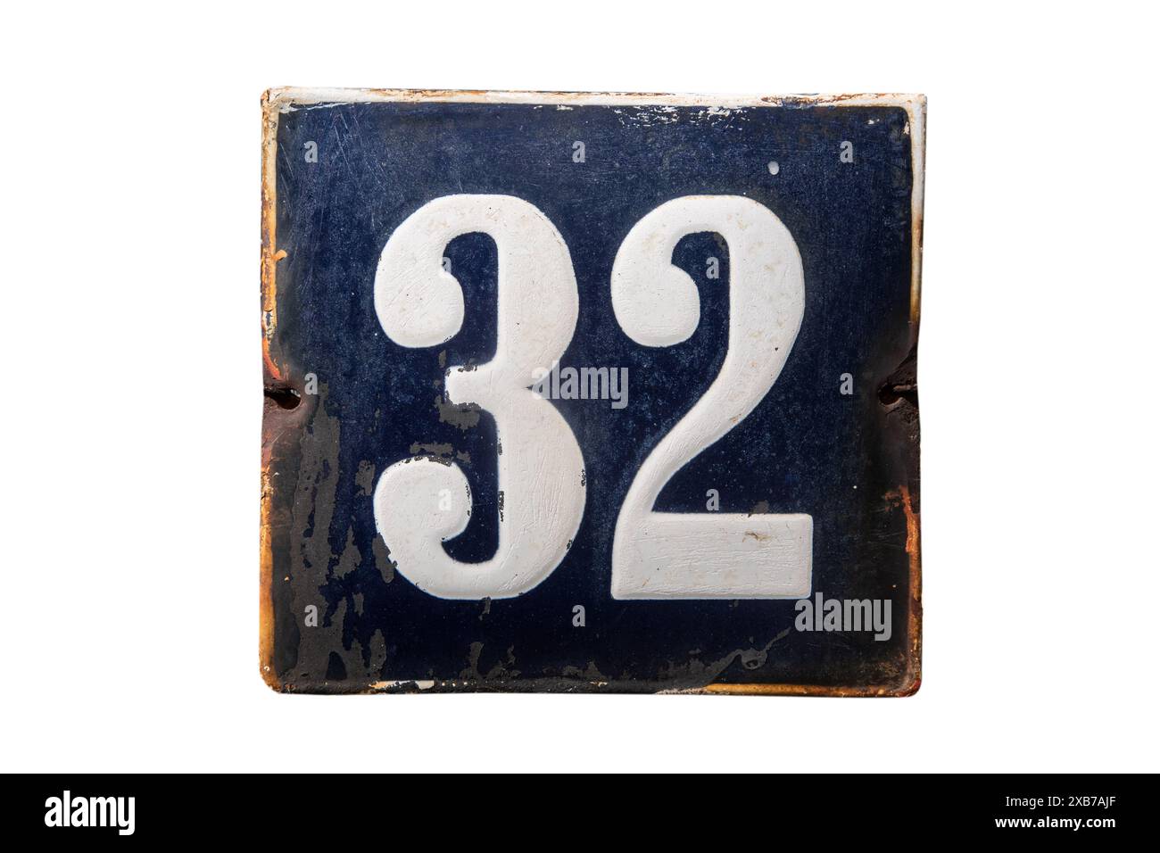 Weathered grunge square metal enameled plate of number of street address with number 32 isolated on white background Stock Photo