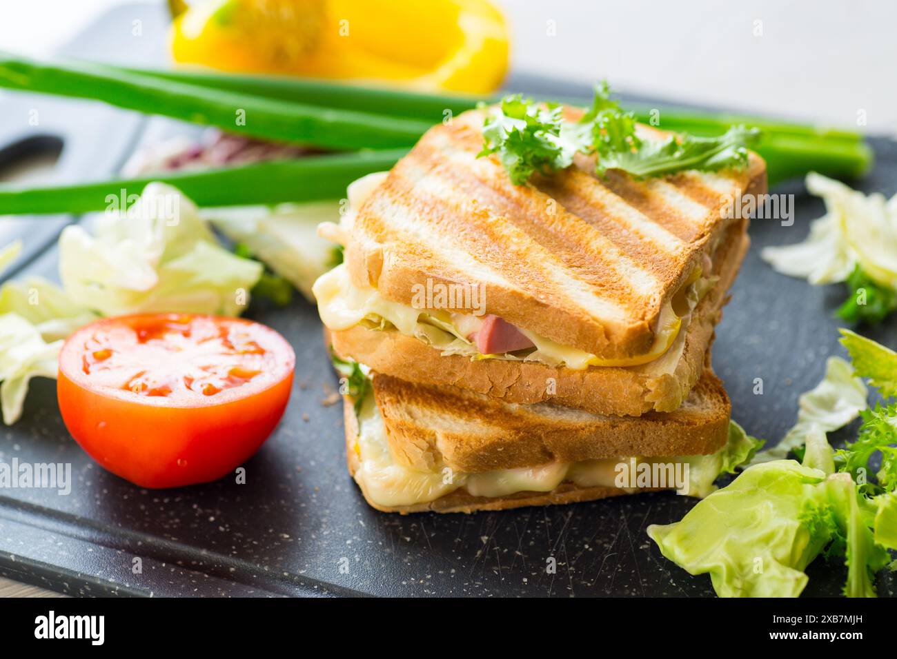 fried toasts with filling, salad leaves, tomatoes Stock Photo - Alamy