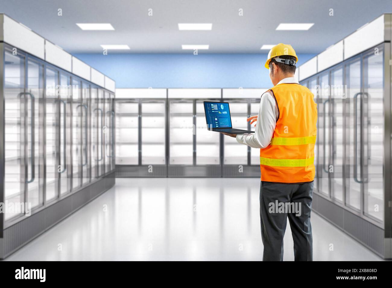 Technician or engineer check on fridge in store Stock Photo