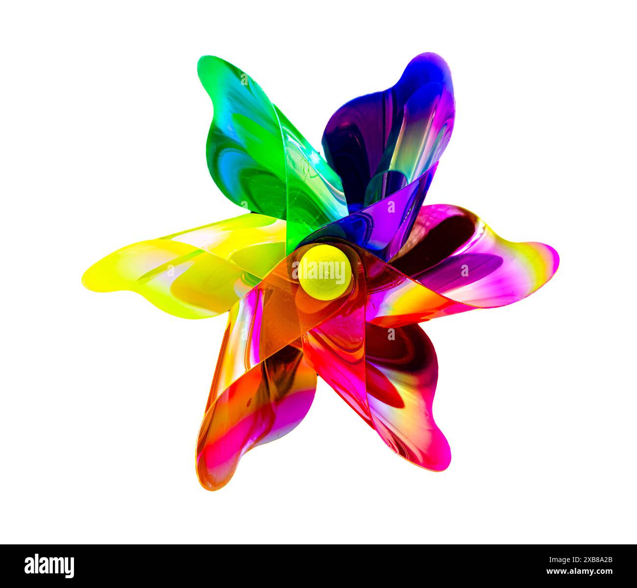 A front view of a regular toy pinwheel windmills with six differently psychedelic colored vanes rotating on a stick on a white screen background Stock Photo