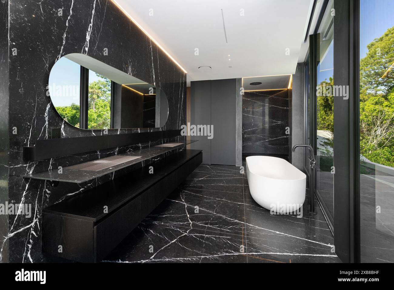 A bathroom featuring a bathtub and vanity Stock Photo