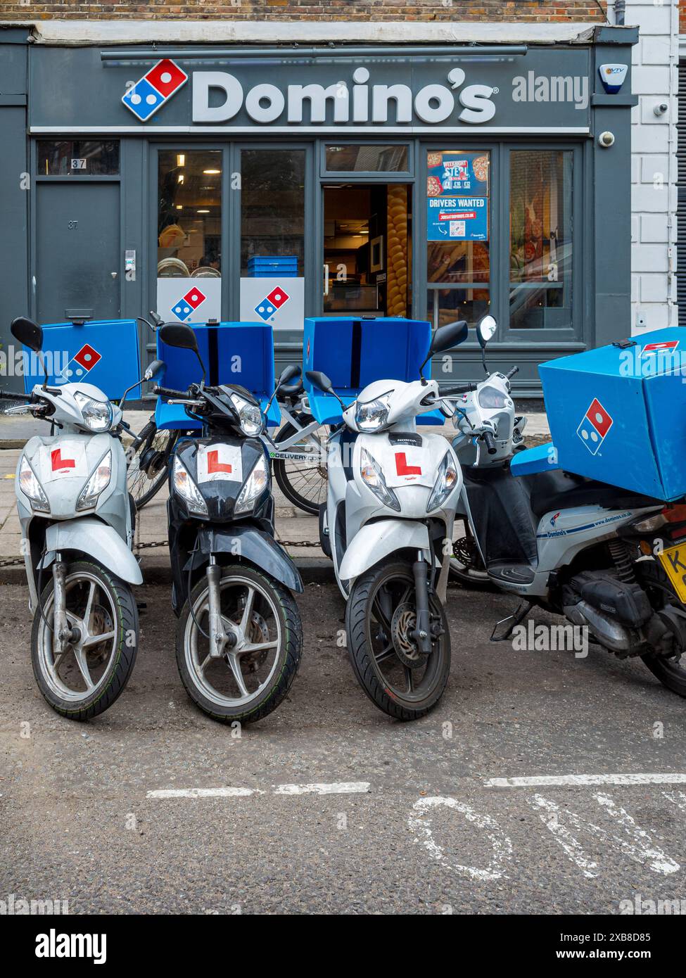 Dominos pizza delivery domino s pizza delivery bikes outside a domino