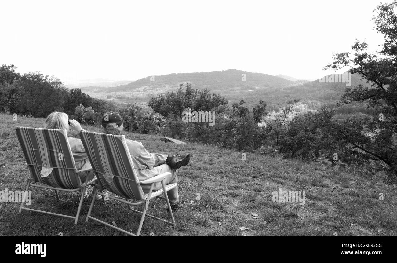 Couple enjoying the view of Blue Ridge Mountains at Walnut Cove overlook near Asheville, NC. USA Stock Photo