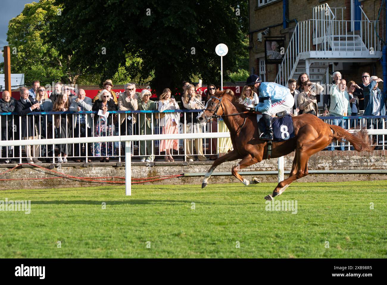 Horse Approval (No 8) ridden by jockey Tom Marquand wins the Download the Racing App 43 Now Novice Stakes at the Irish Night Monday Night Evening Racing meeting at Royal Windsor Racecourse in Windsor, Berkshire. Owner Highclere Thoroughbred Racing - Dali, Trainer William Haggas, Newmarket, Breeder Highclere Stud, Sponsor Highclere Thoroughbred Racing Ltd Stock Photo