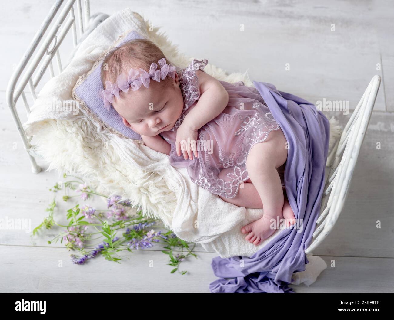 Newborn girl sleeping in bed hi-res stock photography and images - Alamy