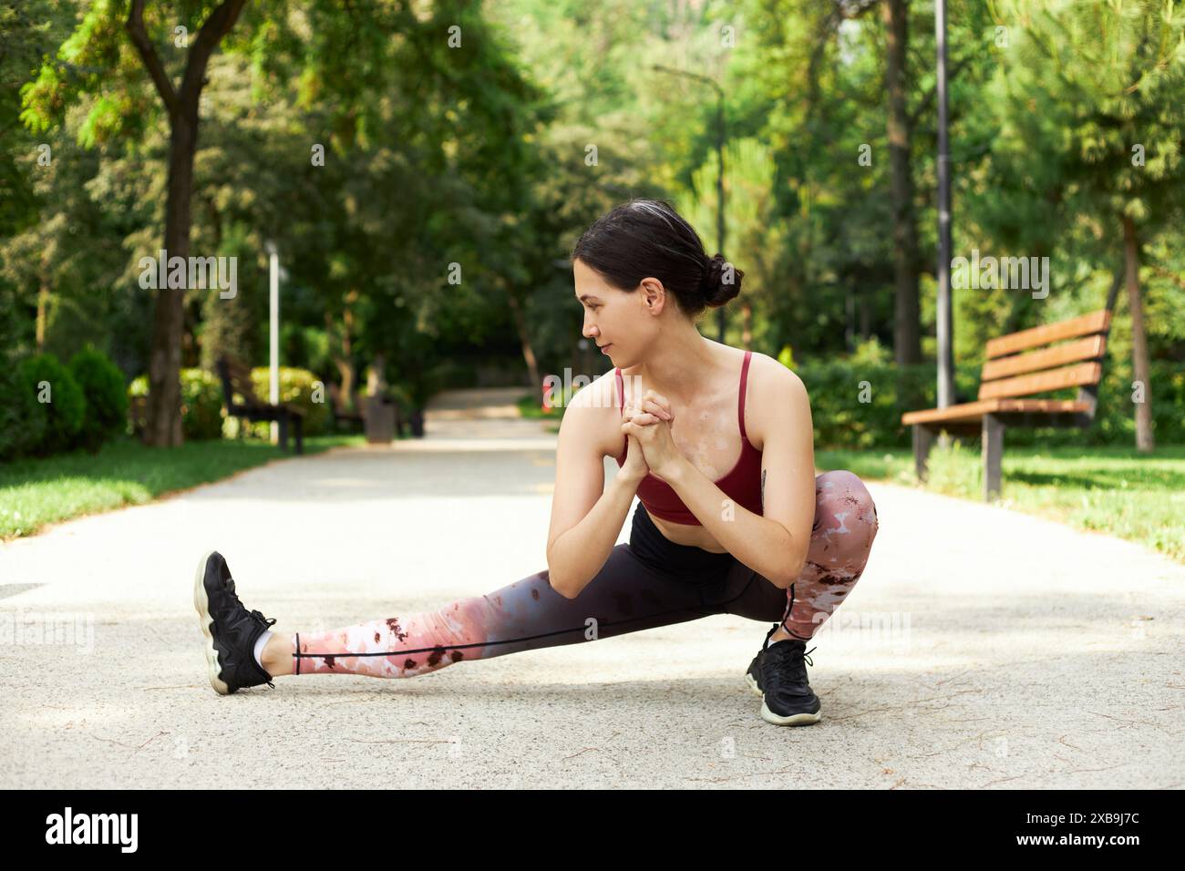 Calm young athlete stretching legs hi-res stock photography and images ...