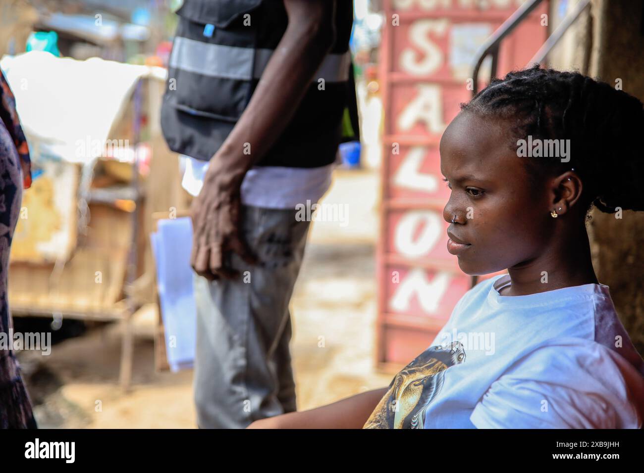 A resident waits as she gets her free Hypertension diagnostic test done by a community health volunteer (CHVs) from Plan International Kenya on the occasion of World Hypertension Day. (Photo by Donwilson Odhiambo / SOPA Images/Sipa USA) Stock Photo