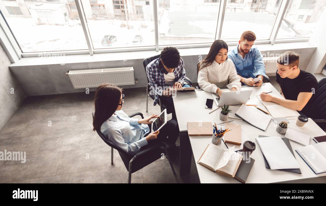 Group of People Sitting Around Table in Office, View Above Stock Photo ...