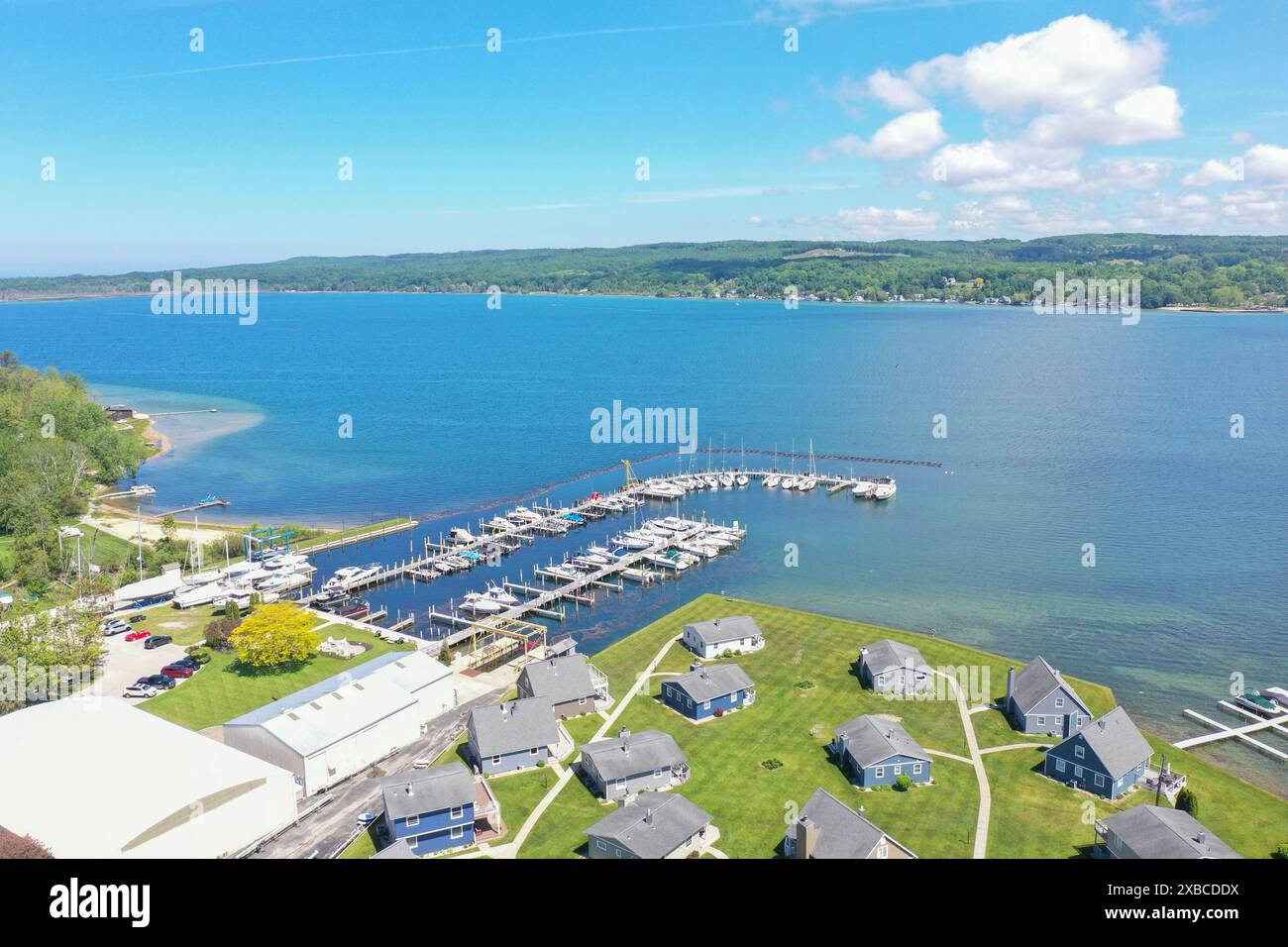 Aerial view of a marina with boats docked, surrounded by residential ...