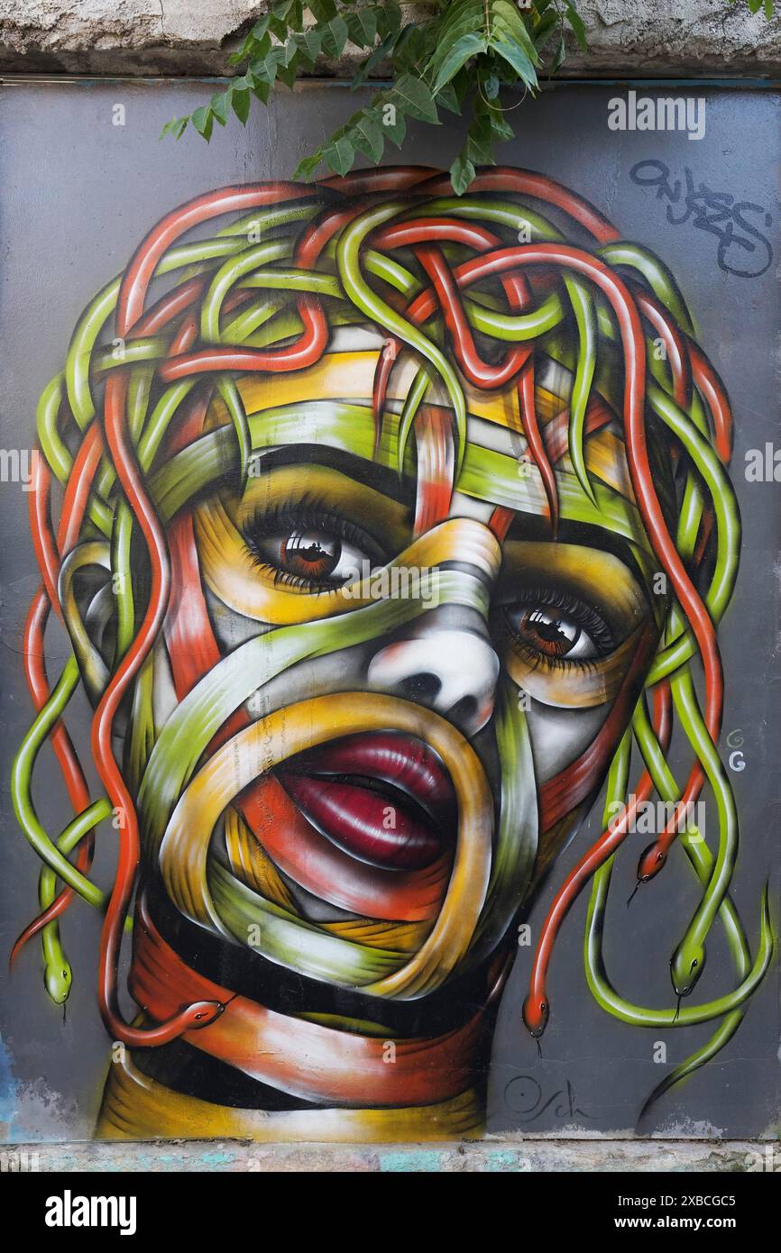 Medusa, female head with hair of colourful snakes, mural in the Anafiotika district, street art, Athens, Greece Stock Photo