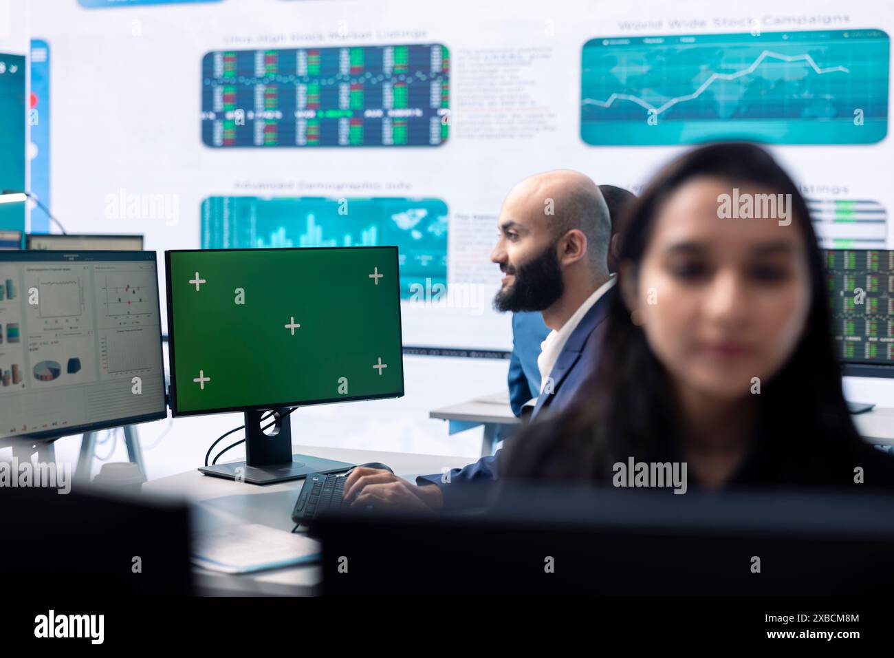 Enterprise worker examining annual sales statistics next to green ...