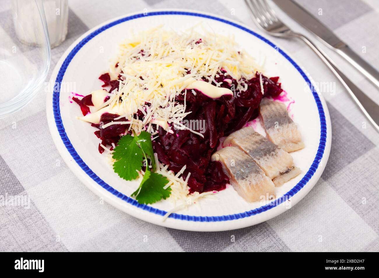 Beetroot served with cheese and pickled mackerel Stock Photo