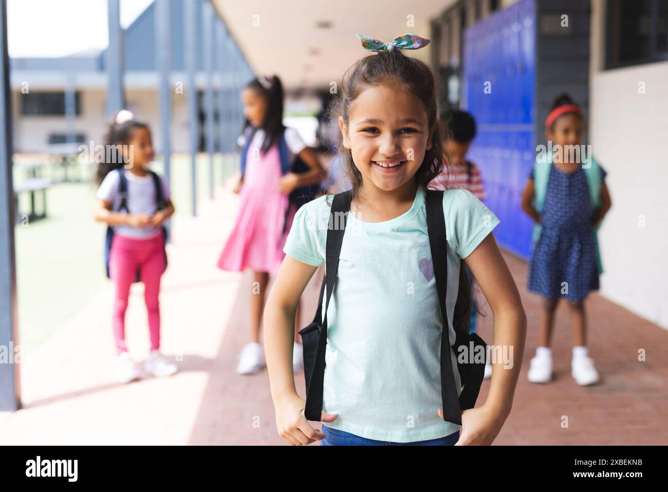 Students with backpacks standing together, smiling and ready for school ...