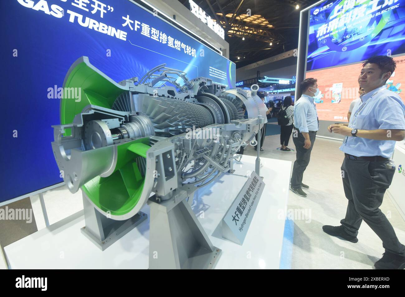 Gas Engine Science Fair SHANGHAI, CHINA - JUNE 12, 2024 - Visitors view a model of a ...