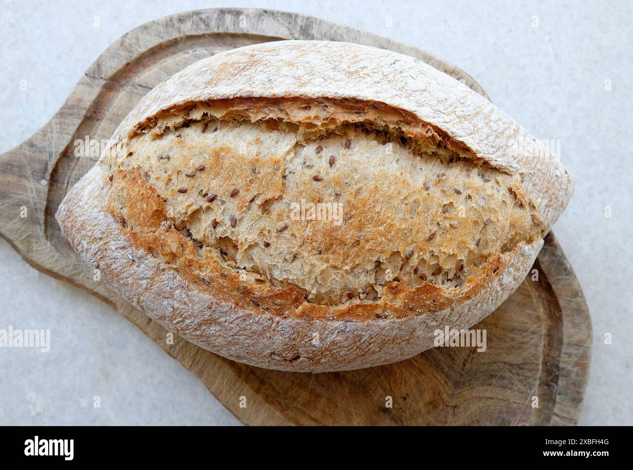 sourdough bread on wooden cutting board Stock Photo